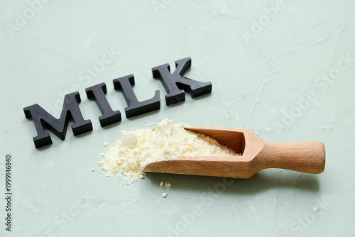 Word Milk and wooden scoop ...