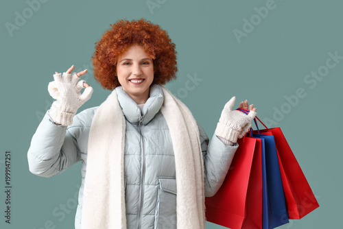 Redhead young woman in wint...