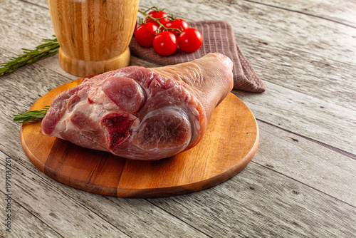 Raw pork knuckle over board