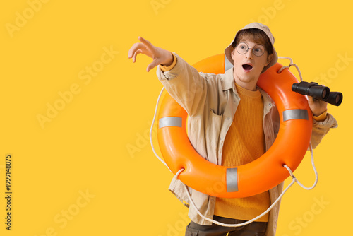 Funny young fisherman with ...