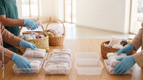 people preparing food in containers.