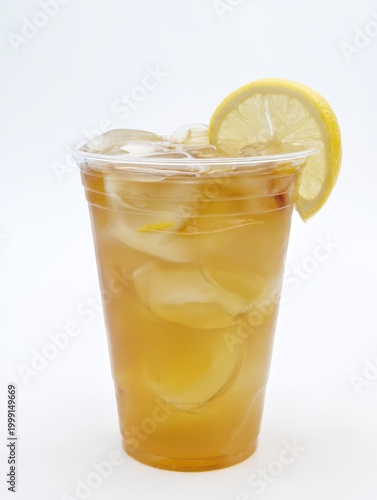 Iced Tea with Lemon Slice and Ice Cubes in Plastic Cup