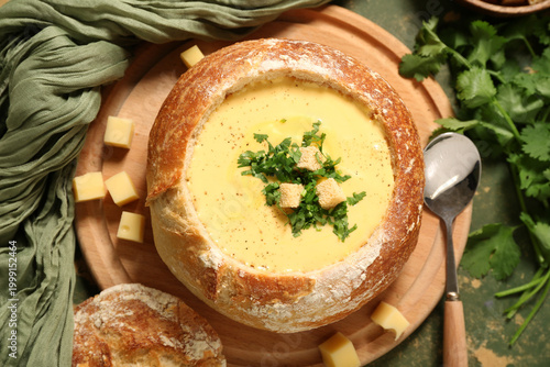 Cheese soup in bread bowl w...