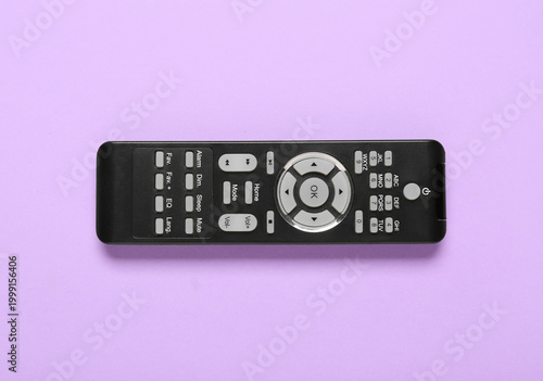 TV remote control on purple...