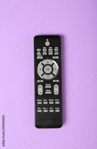 TV remote control on purple...