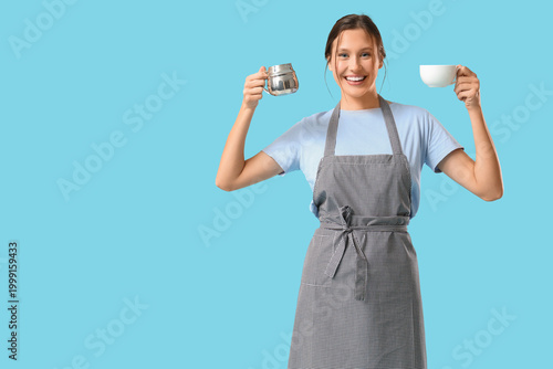 Happy young female barista ...