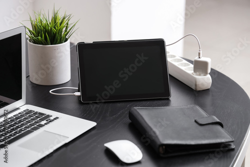 Modern laptop with tablet a...