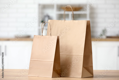 Paper bags on table in kitchen