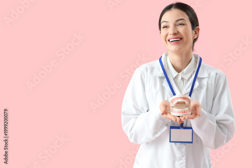 Young female dentist with j...