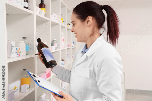 Female pharmacist with clip...