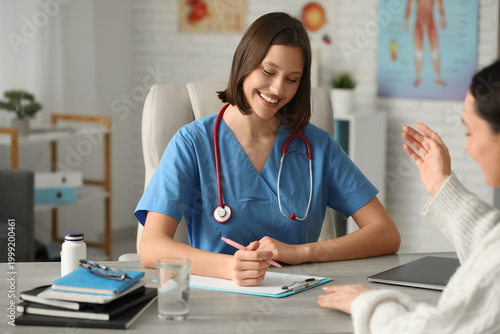 Happy young female doctor w...