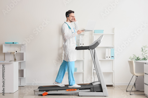 Male doctor in headset with...
