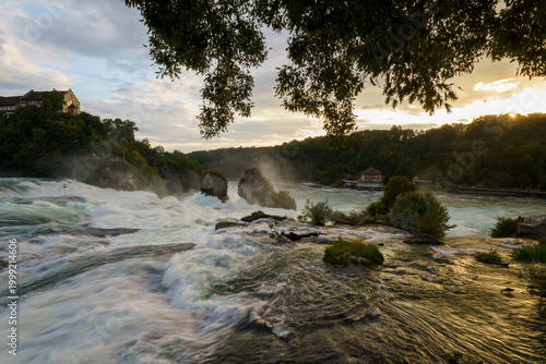 Schilderij op canvas Majestic sunset over Rhine Falls (Rheinfall) and Laufen Castle (Schloss Laufen),