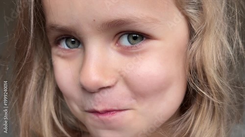 Pretty little girl looking to camera an smiling