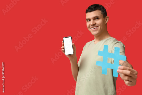 Young man with hashtag symb...