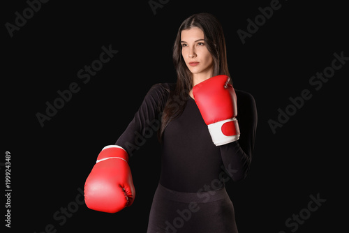 Sporty young woman in boxin...