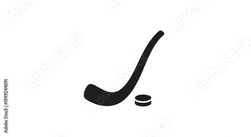 Hockey Stick and Puck Closeup.