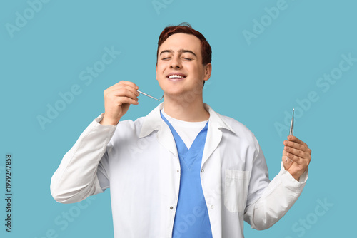 Male dentist with dental to...