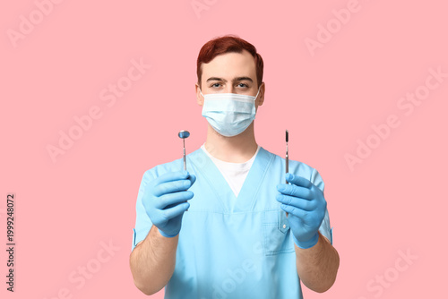 Male dentist in medical mas...