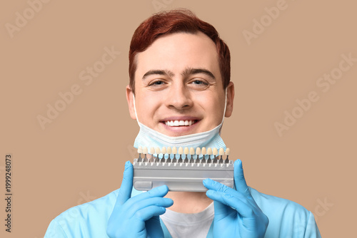 Male dentist with dental sh...