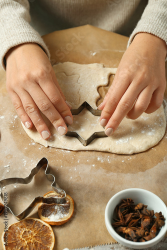 Woman cutting dough for Chr...