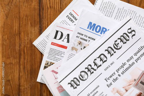 Morning newspapers on woode...