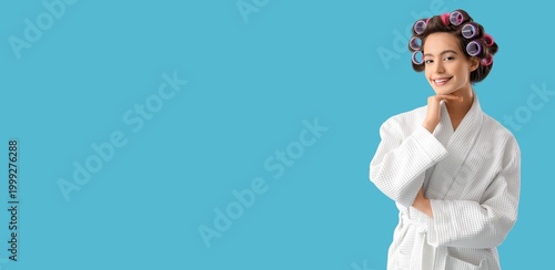 Young woman in bathrobe and...