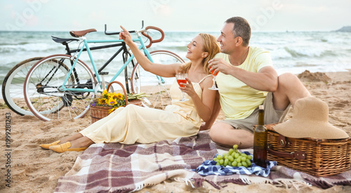 Mature couple having picnic...