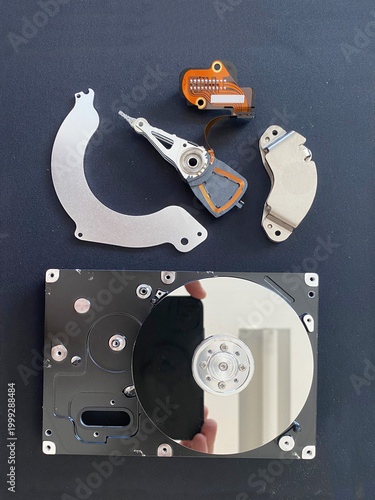 Close-up view of a disassembled single-platter vintage hard drive