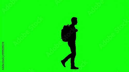 Silhouette of a person with a backpack walking against a vibrant green background