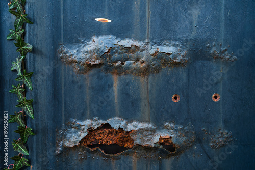 Rusty metal surface with peeling paint and corrosion texture