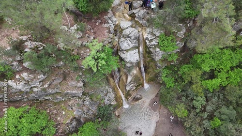 Stunning Aerial Views of Waterfall and Lush Green Forest