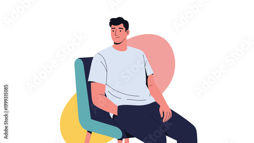 Young man sitting in a comfortable chair looking away while relaxing against a background of yellow and pink abstract circles.