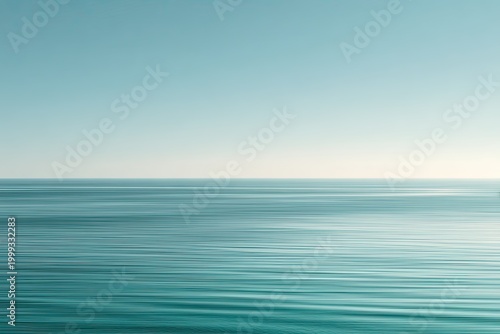 Serene ocean horizon with gentle waves under a pale sky