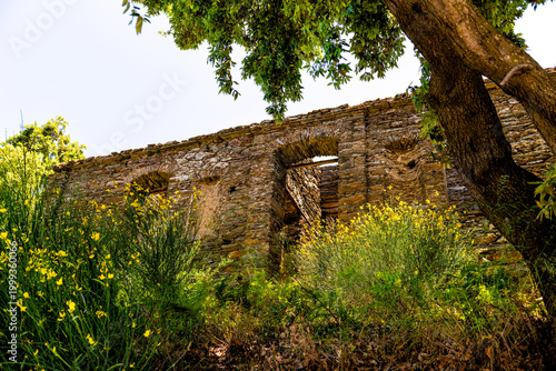 Ancient Greek slate flat stone rock home house building of stacked flat stones plates stimata in Aegean Ikaria, Greece ancient architecture