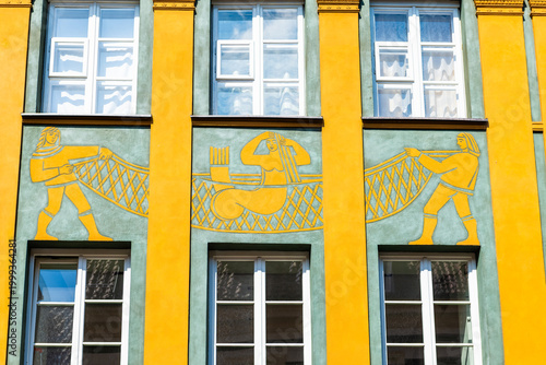 Mermaid of Warsaw, Poland syrenka warszawska symbol coat of arms ornate carving on building exterior, myth legend in old town market square