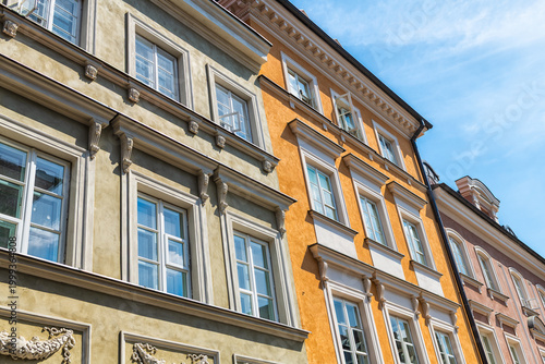 Warsaw, Poland ornate carving on colorful multicolored building exterior in old town of nowe miasto street