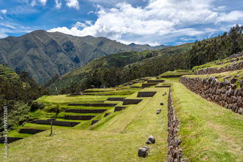 Inca archaeological site of Chinchero with terraces and mountain backdrop