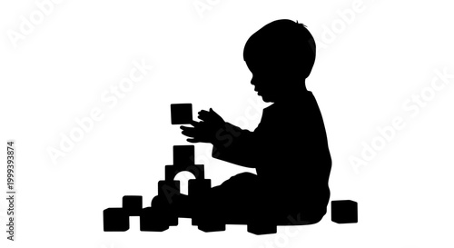 Silhouette of a young child sitting on the floor and playing with building blocks.