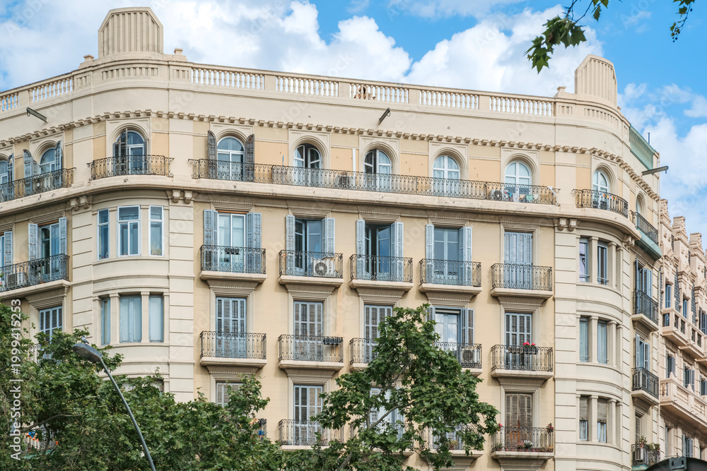 Obraz premium Classic Residential Building Facade Barcelona With Balconies And Shutters, Mediterranean Style