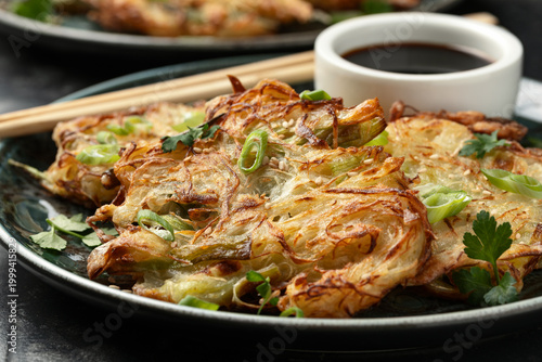 Korean cabbage pancake with vegetables and soy sauce. Asian food style