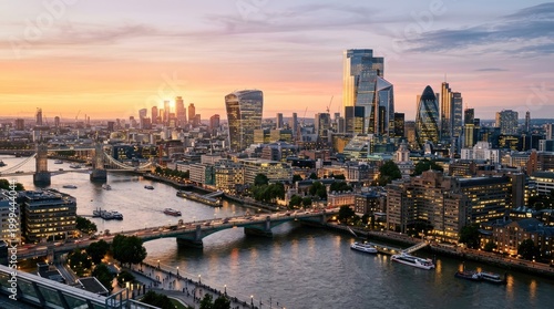 London city skyline at sunset, with river, buildings and Tower Bridge