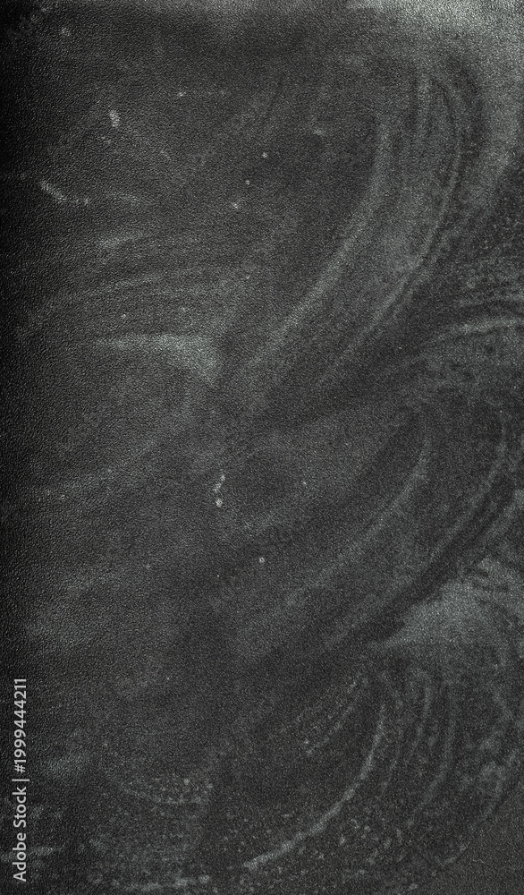 Fototapeta premium texture of blurred chalk residue on black paper, creating a soft, dusty, and artistic background with subtle gradients and organic patterns.