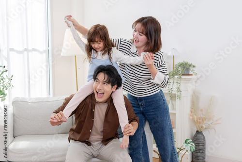 Bilde på lerret Family sharing joyful moments together in living room