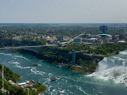The American Falls and Bridal Veil Falls, the U.S. Customs and Border Protection – Rainbow Bridge Port of Entry, and the Prospect Point Observation Tower in Niagara Falls, Ontario, Canada.