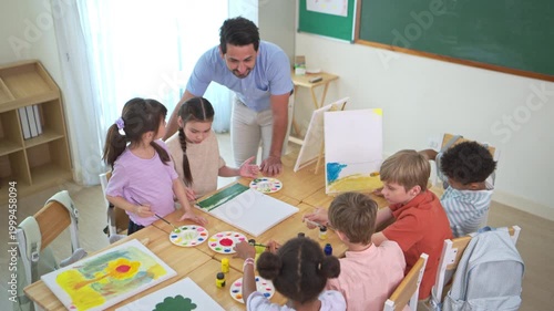 Teacher guiding diverse students during painting activity in an international classroom, supporting creativity and skill development