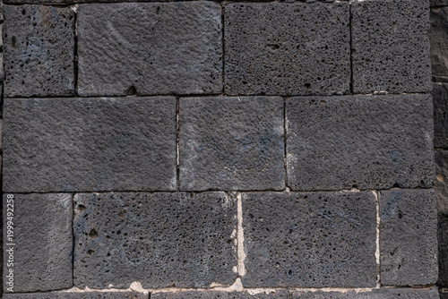 Volcanic stone wall texture of 1600s castle for design backgrounds