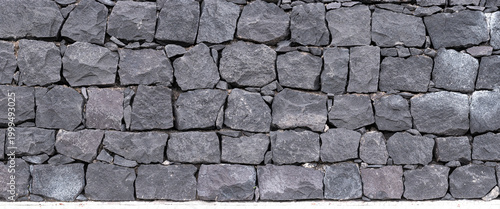 Tableau sur toile Panoramic texture of natural volcanic stone wall from Tenerife Island, Spain