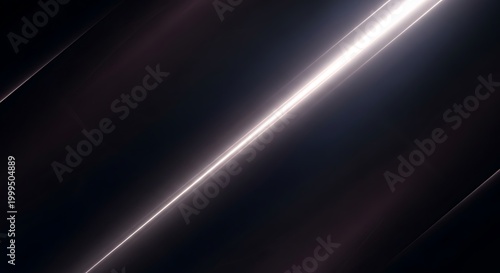 Dramatic light flare a streaking white light across a dark textured background