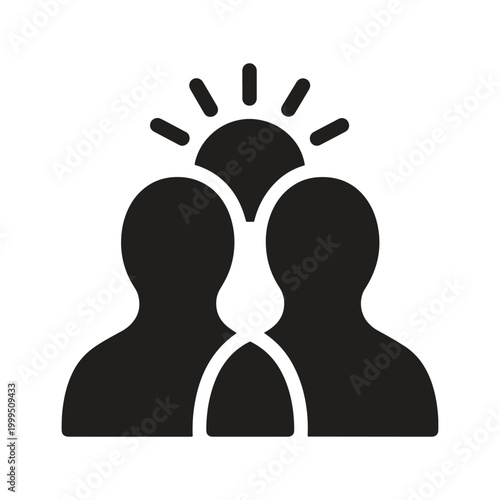 Black silhouette of two people with a sunburst or idea symbol above their heads inspiration
